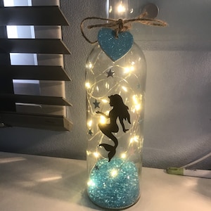 Mermaid holding a starfish light up bottle.  Can be personalised. Free gift messaging service & gift bag.