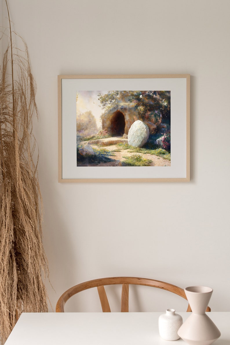 May include: A watercolor painting of a stone tomb with a large, round stone rolled away from the entrance. The tomb is set in a lush, green landscape with trees and flowers.
