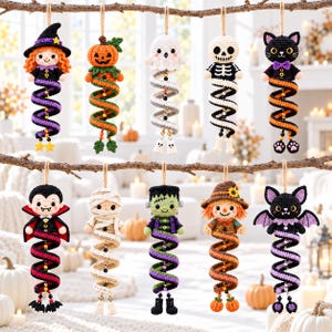 May include: A set of ten hanging crochet ornaments featuring Halloween characters including a witch, pumpkin, ghost, skeleton, cat, vampire, mummy, Frankenstein monster, scarecrow, and bat, each with a spiraling body and hanging loop.
