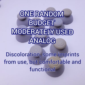 May include: A collection of ten gray and beige analog joystick caps. The caps are moderately used and show signs of discoloration and imprints from use. The text "ONE RANDOM BUDGET MODERATELY USED ANALOG" is written in black text on a white background. The text "Discoloration, some imprints from use, but comfortable and functional" is written in black text on a white background.