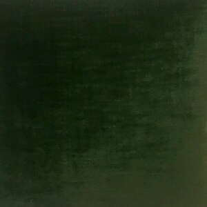 May include: A solid dark green fabric swatch. The fabric has a slightly textured surface.