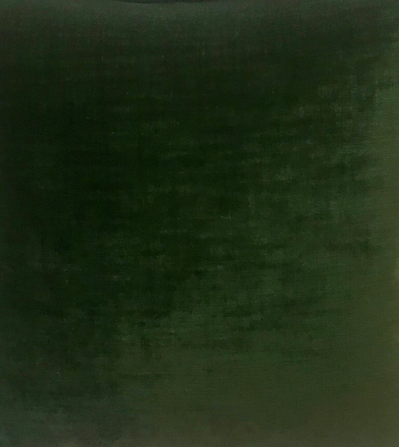 May include: A solid dark green fabric swatch. The fabric has a slightly textured surface.