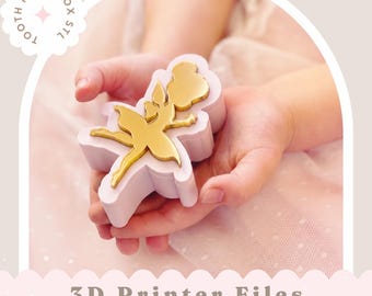 May include: A light pink tooth fairy box featuring a gold-colored fairy silhouette on the lid. The text TOOTH FAIRY BOX STL is visible in a circular badge, and the text 3D Printer Files STL Fairy Box Instant Download is at the bottom.