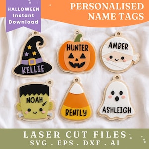 May include: Six wooden Halloween-themed name tags featuring a black witch hat with the name KELLIE, an orange pumpkin with HUNTER, a white mummy with AMBER, a green Frankenstein monster with NOAH, a candy corn with BENTLY, and a white ghost with ASHLEIGH.