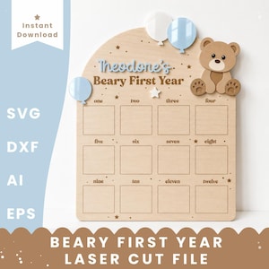 May include: A light wood arched milestone board featuring a brown teddy bear, blue and white balloon accents, and the text Theodore's Beary First Year. The board includes twelve empty square frames labeled with the numbers one through twelve.