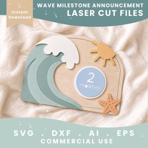 May include: A wooden arch-shaped milestone plaque featuring a layered green wave, a white foam crest, a yellow sun, and an orange starfish. A circular light blue insert in the center displays the white text 2 MONTHS. The design includes laser cut files.