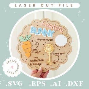 May include: Wooden Easter Bunny tray with a scalloped edge. The tray features a carrot, a key, and the words "Easter Bunny" in blue and pink. Text includes "Hop on over!" and "Love Andie, Theo & Bailey!"