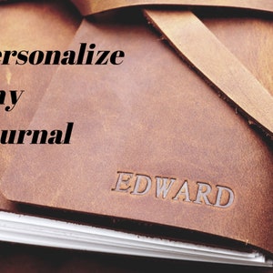 May include: A brown leather journal with the word "EDWARD" embossed on the cover. The text "Personalize Any Journal" is printed on the front cover.