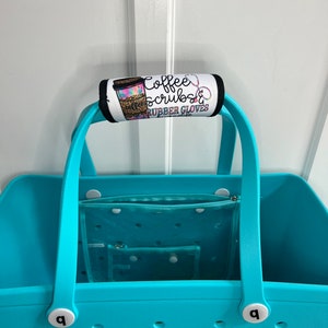 May include: A turquoise tote bag with a handle wrap that reads "Coffee, Scrubs & Rubber Gloves". The bag has a clear interior organizer and white accents. The handle wrap features a coffee cup design.