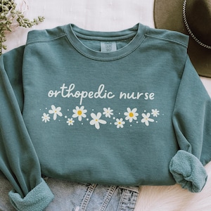 Orthopedic Nurse Sweatshirt, Comfort Colors Ortho Nurse Shirt, Ortho Nurse Crewneck, New Nurse Graduation Gift,Orthopedic Nursing Sweatshirt