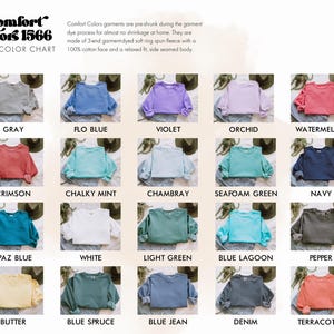 May include: Color chart of Comfort Colors 1566 sweatshirts in various colors, including gray, blue, violet, orchid, and watermelon. The chart displays the colors of the sweatshirts, with the names of the colors below each sweatshirt.