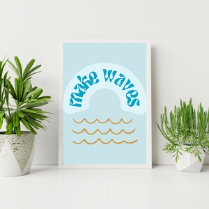 May include: A light blue printable poster with the text "make waves" in a blue retro font, forming an arch over three wavy lines in gold.