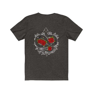 May include: Dark grey t-shirt featuring a white graphic of a snake entwined with roses and celestial symbols.