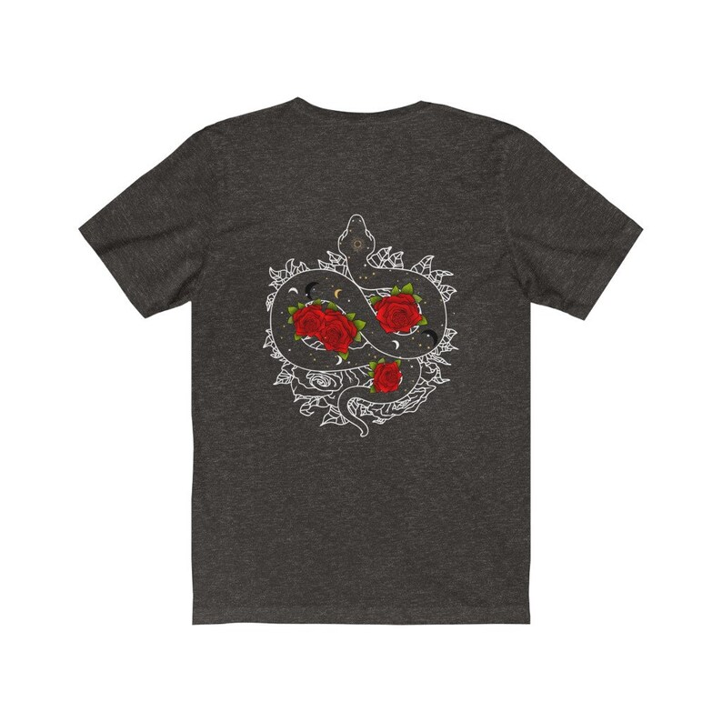 May include: Dark grey t-shirt featuring a white graphic of a snake entwined with roses and celestial symbols.