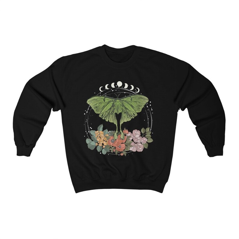 May include: Black sweatshirt with a green luna moth graphic, surrounded by flowers and a crescent moon design.