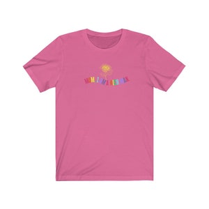 May include: Pink short-sleeved t-shirt with a rainbow graphic that says "MOM I AM A RICH MAN."