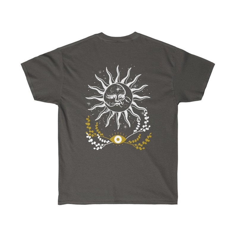 May include: A dark gray t-shirt with a white sun and moon design with a gold eye and floral accents.