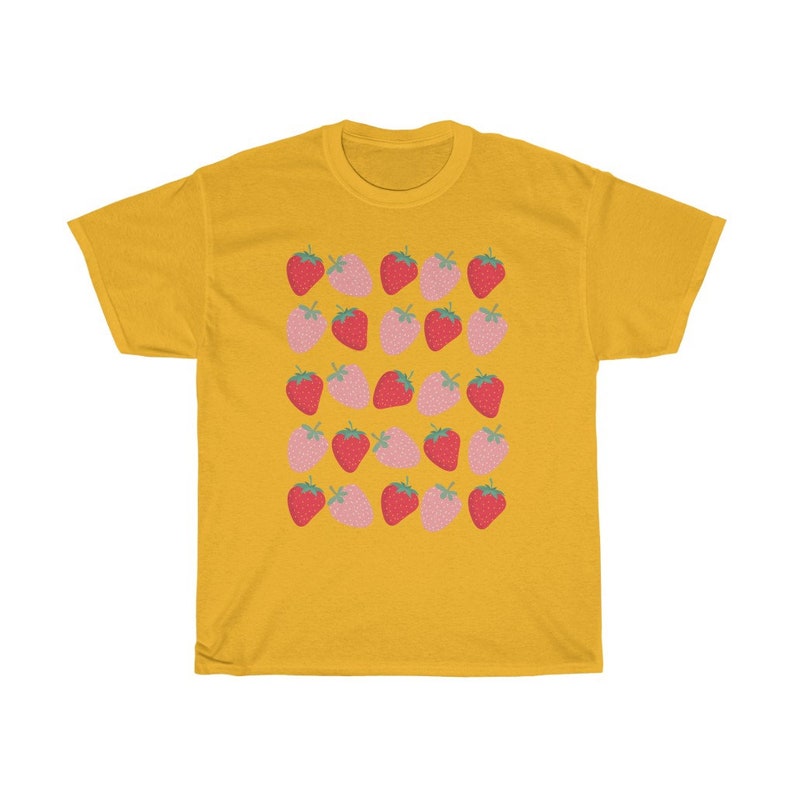 May include: A yellow t-shirt with a pattern of pink and red strawberries. The strawberries are arranged in rows and are all facing the same direction.
