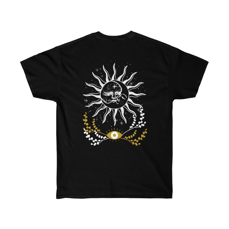May include: Black t-shirt with a white sun and moon design with a gold eye in the center. The sun and moon are surrounded by white stars and gold floral sprigs.