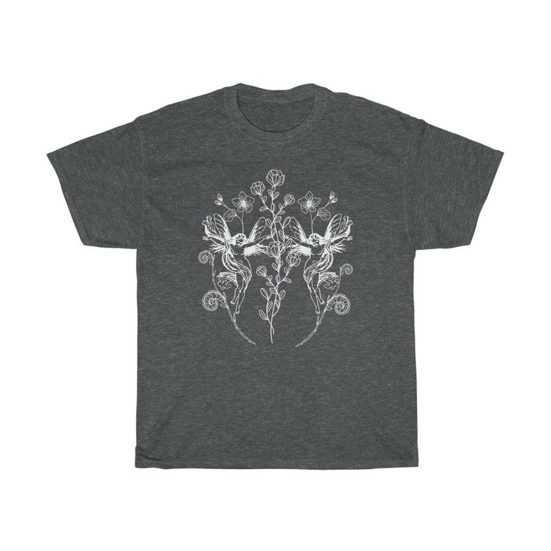 May include: Dark heather gray t-shirt featuring a white illustration of two winged figures surrounded by flowers and foliage. The design is symmetrical, with the figures facing each other. The shirt has a classic crew neck and short sleeves.