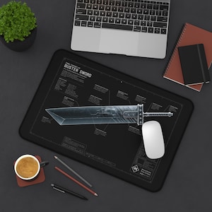 May include: A rectangular black desk mat featuring a technical blueprint illustration of the Final Fantasy VII Buster Sword in white lines and text. The mat displays detailed schematic labels, a white computer mouse, and a dark gray border.