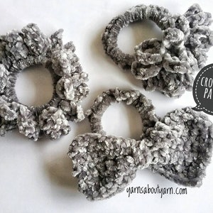 May include: Three gray crocheted hair scrunchies, two are round and one is a bow shape. The text "CROCHET PDF PATTERN" is in a speech bubble.