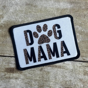 May include: White patch with black text that reads "Dog Mama" with a paw print in a leopard print pattern.