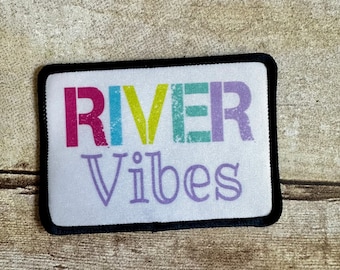 River Vibes patch with black border