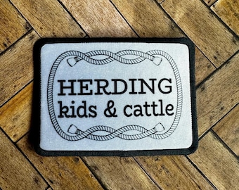 Herding kids and cattle patch