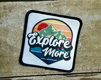 Explore More hat patch with black border