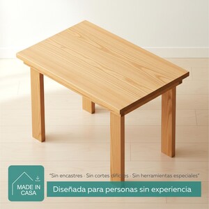 Può includere: Un tavolo rettangolare in legno chiaro con quattro gambe. Il tavolo ha un design semplice e minimalista. Il testo sull'immagine dice: "Progettato per persone senza esperienza."