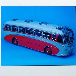 May include: A brochure featuring a model bus with a red and gray color scheme. The brochure is for a Transport Memorabilia auction held by Christie's in South Kensington on August 13, 1992.