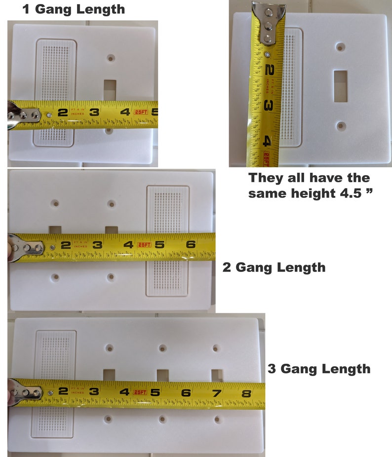 May include: Three white electrical outlet covers with different numbers of openings. The covers are measured with a yellow tape measure. The covers are 4.5 inches tall. The first cover has one opening, the second cover has two openings, and the third cover has three openings.