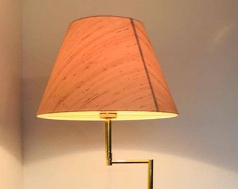 A very beautiful mid century floor lamp / floor lamp made of brass with a lampshade from the 70s.