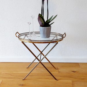 Very beautiful French side table / bedside table / coffee table from the 60s made of brass with removable tray.