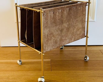 Mide-Century book stand / newspaper stand from the 70s made of brass and suede.