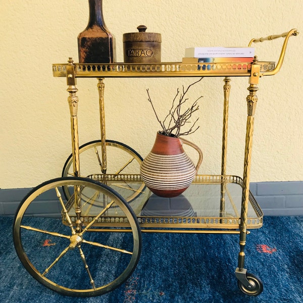 Bar trolley / serving trolley / tea trolley made of brass with two glass plates on rubber wheels from the 50s