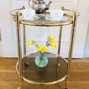 Hollywood Regency bar cart / serving cart / tea cart from the 70s in gold