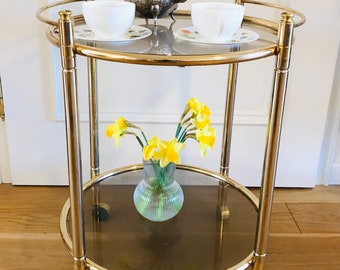 Hollywood Regency bar cart / serving cart / tea cart from the 70s in gold