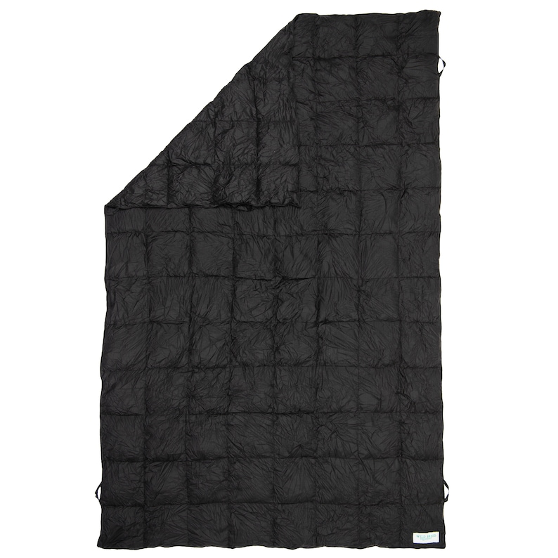May include: A black quilted blanket with a white tag that says "Made in USA".