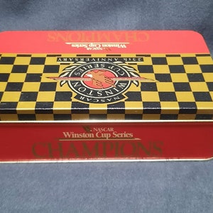 NASCAR 25TH Anniversary  WC Champion Driver Book Safety Mataches in tin case.