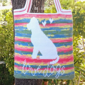 May include: A colorful crocheted tote bag with a white silhouette of a dog and the text "Love dogs" in white. The bag has a striped pattern in shades of pink, yellow, blue, and green.
