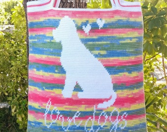 May include: A colorful crocheted tote bag with a white silhouette of a dog and the text "Love dogs" in white. The bag has a striped pattern in shades of pink, yellow, blue, and green.