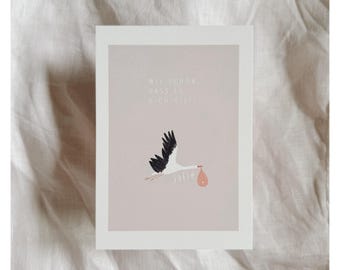 May include: A pink card with a white border features a black and white stork carrying a pink bundle. The text on the card reads "Wie schön, dass es dich gibt!" and "Sofia".