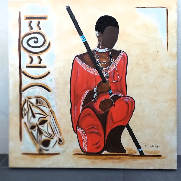 Afrique ,guerrier Massaï à genou