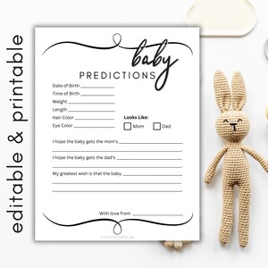 May include: A white paper baby predictions card with black text featuring fields for date, time, weight, length, hair colour, eye colour, and checkboxes for mum or dad. The card includes prompts for wishes and a signature line, accompanied by a tan crochet rabbit.