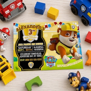 May include: A rectangular birthday invitation card featuring a cartoon bulldog character in a yellow construction hat and vest. The text reads: Alexander's 3rd Birthday, All Paws on Deck, Saturday Sept. 30th 4:00PM-6:00PM, 123 Lookout Tower Blvd, Adventure Bay, NY 10003, RSVP: Mom 555-555-5555.