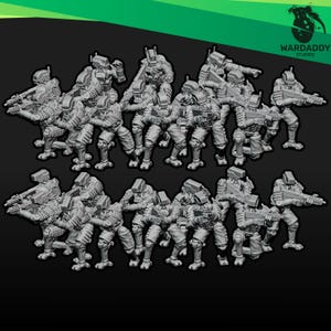 May include: A collection of grey miniature soldier figurines arranged in two rows. Each figure wears tactical armor, a helmet, and carries a rifle. The figures are posed in various combat stances, including standing and kneeling positions.