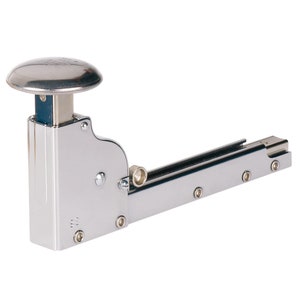 May include: A silver heavy-duty staple gun with a round, silver top. The staple gun is designed for use with heavy-duty staples.