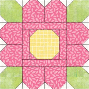 May include: A pink and green patchwork quilt block with a yellow octagon in the center. The pink fabric has a white leaf pattern. The green fabric has a white grid pattern.
